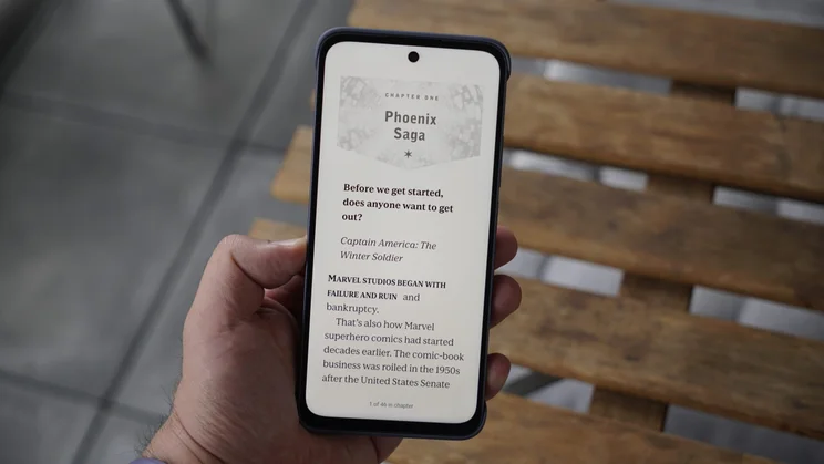 TCL Nxtpaper 70 Pro in hand, displaying a book in colour ink mode