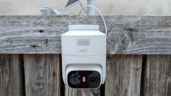 The EufyCam C37 pictured from in front, mounted on a wooden slatted wall
