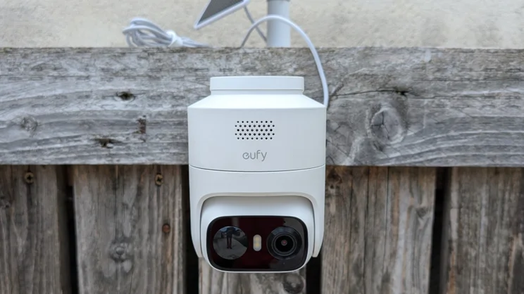 The EufyCam C37 pictured from in front, mounted on a wooden slatted wall