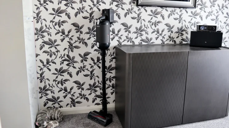 The Halo Capsule XR stood up on its own next to a black cabinet
