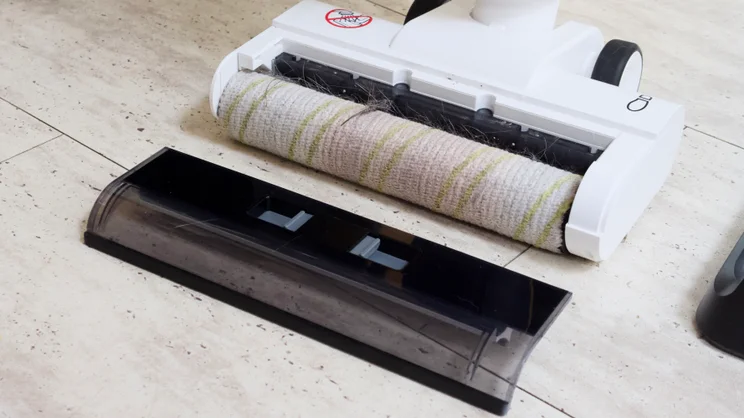 The Karcher FCV 3's cleaning head, showing hair clogged in the inlet slot