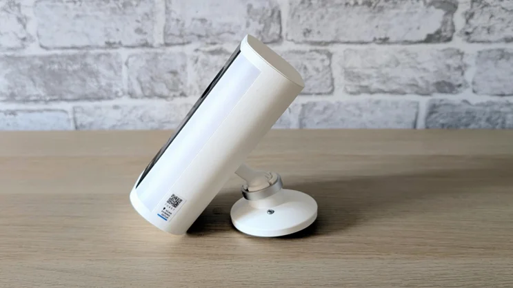 The Ring Spotlight Cam Pro Plug-In (2nd gen) with mount attached pictured from the side