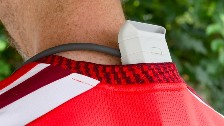 The Sony Reon Pocket Pro Plus picturedfrom the rear left being worn under a loose fitting football shirt