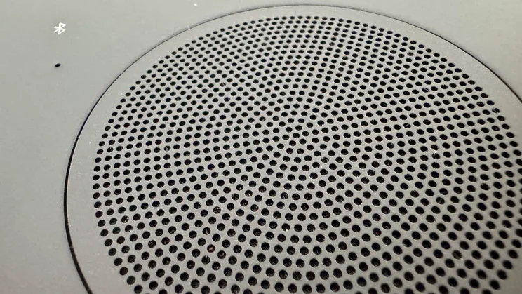 The grille covering the upfiring speaker on the Bose Lifestyle Ultra Speaker