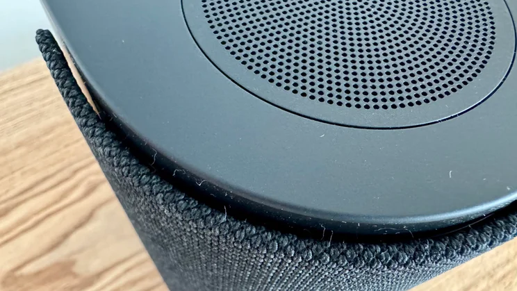 The upfiring speaker and acoustic fabric on the front of the Bose Lifestyle Ultra Speaker