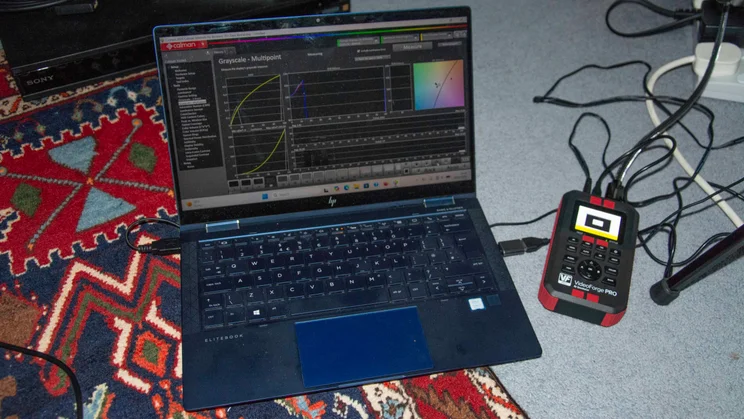The laptop used to test the LG C6 OLED TV alongside a VideoForge pattern generator