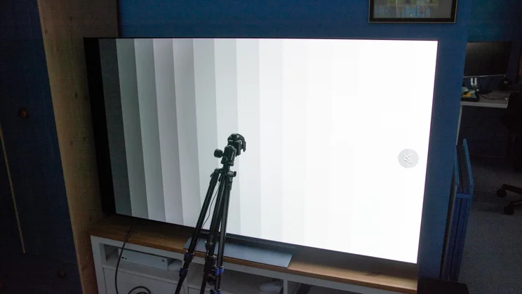 The LG C6 OLED TV being tested using a colorimeter while displaying a graduated greyscale pattern