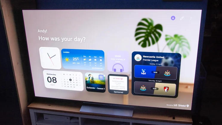 The 65in LG C6 OLED TV on a wooden stand displaying the new "My Page" screen