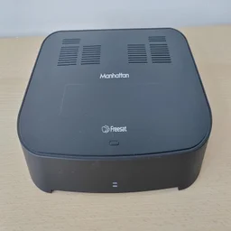 The Manhattan S4-R Freesat TV Recorder on a wooden table