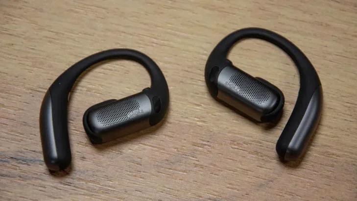 The Shokz OpenFit Pro on a wooden table