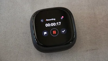 The charging case of the Soundcore Liberty 5 Pro Max wireless earbuds with the lid closed and recording a conversation