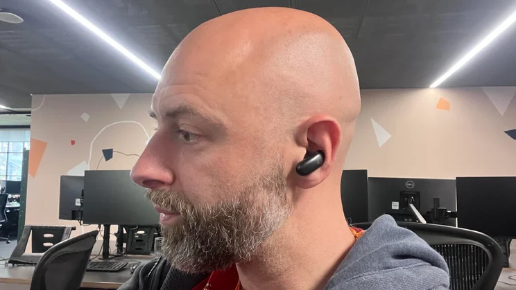 Our reviewer wearing the left Soundcore Liberty 5 Pro Max wireless earbud