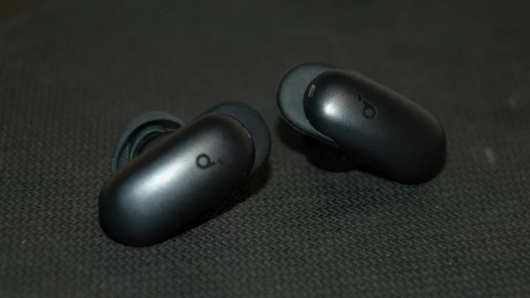 The Soundcore Liberty 5 Pro Max wireless earbuds on a black mouse mat