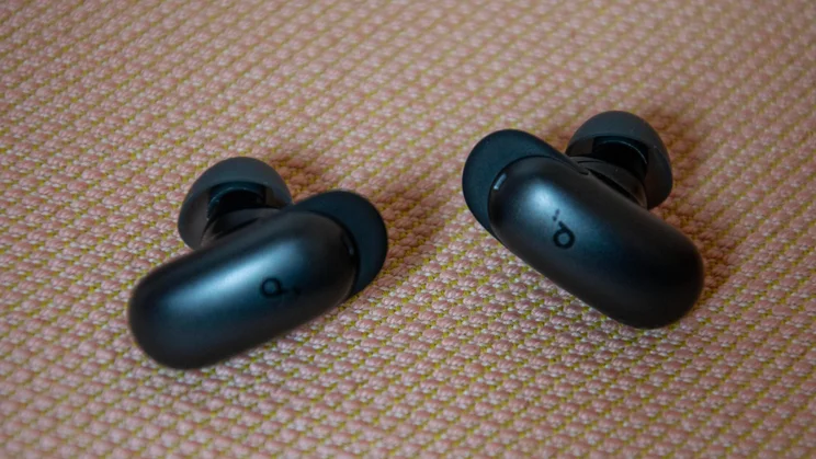 The Soundcore Liberty 5 Pro Max wireless earbuds on a sofa