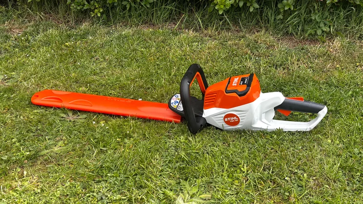 Stihl HSA 50 hedge trimmer - wide shot of entire trimmer on grass