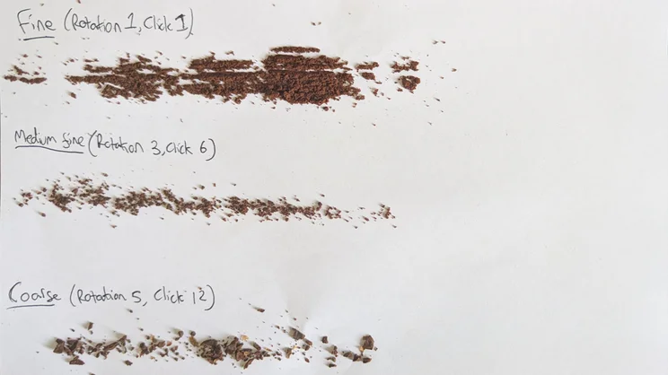 Three lines of ground coffee on a sheet of paper. From top to bottom: Fine (Rotation 1, click 1), Medium fine (Rotation 3, click 6), Coarse (Rotation 5, click 12)