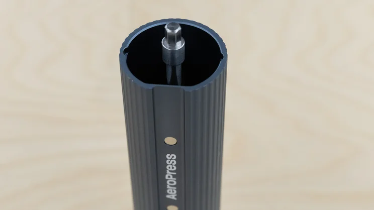 A bird's eye view of the AeroPress Manual Coffee Grinder, without its handle or lid