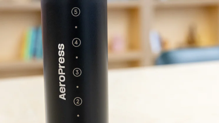 A closeup of the AeroPress Steel coffee maker's exterior fill markings