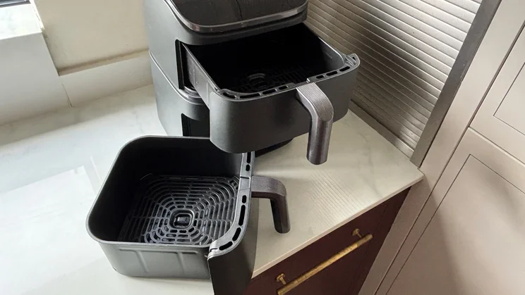 The Cosori Turbo Tower air fryer on a kitchen worktop, with drawers removed