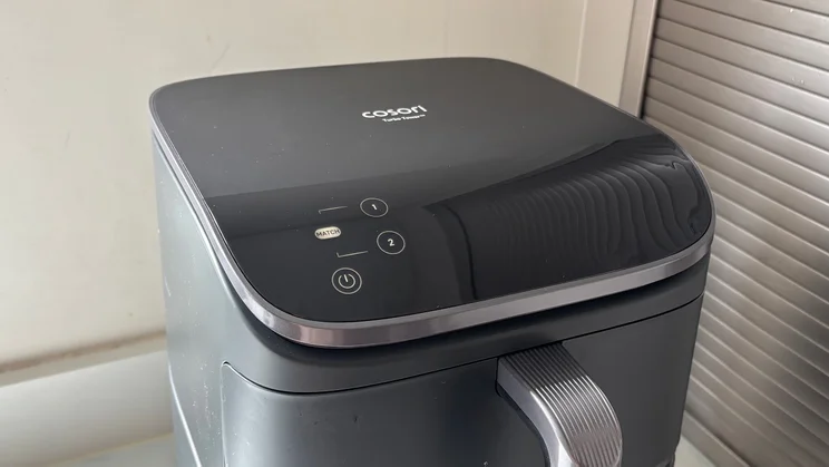 The Cosori Turbo Tower air fryer with its digital display on