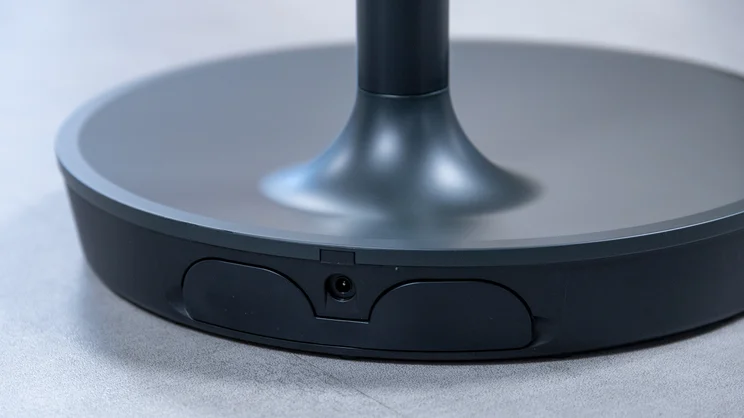 A closeup of the Dimplex DuoCool 2-in-1 fan's base, viewed from the rear