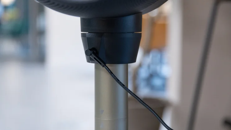 A closeup of the Dimplex Flexblade's power inlet, with cable plugged in
