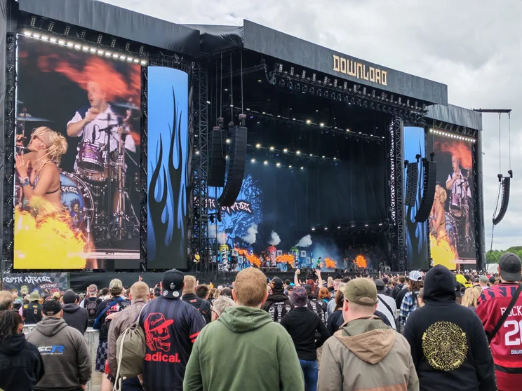 A large stage with a crowd in front