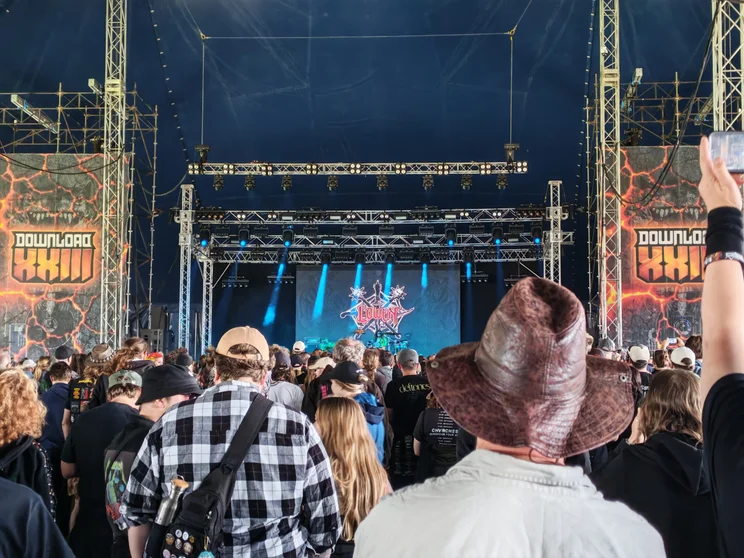 A crowd in front of a small stage