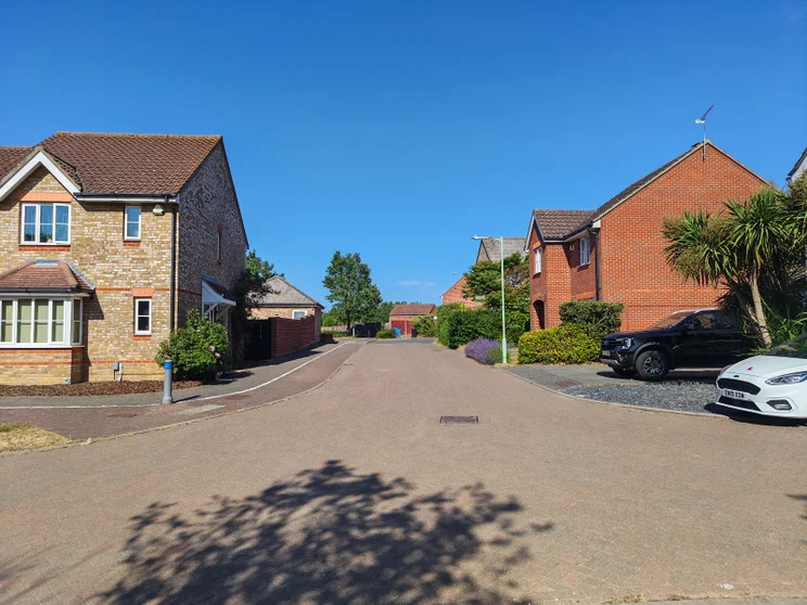 A quiet street with houses on both sides