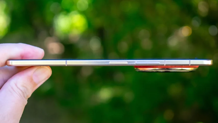 Honor Magic V6 unfolded in hand, side view