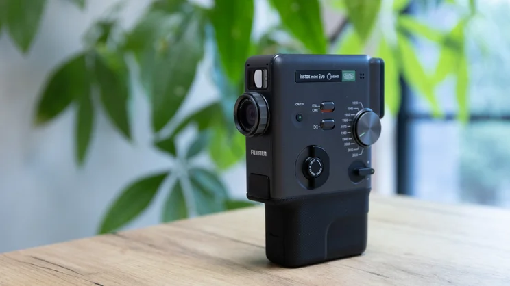 The Instax Mini Evo Cinema on a table in an office