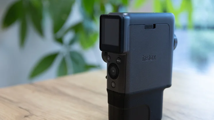 The Instax Mini Evo Cinema on a table in an office