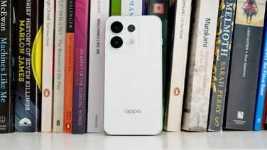 Oppo Reno 16 Pro on a book shelf, rear view