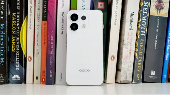 Oppo Reno 16 Pro on a book shelf, rear view