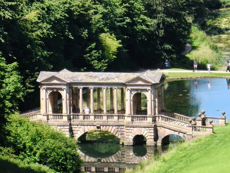 20x zoom of an old bridge over a river