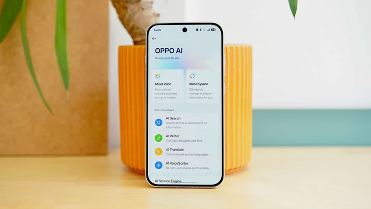 Oppo Reno 16 Pro in front of a plant, display on