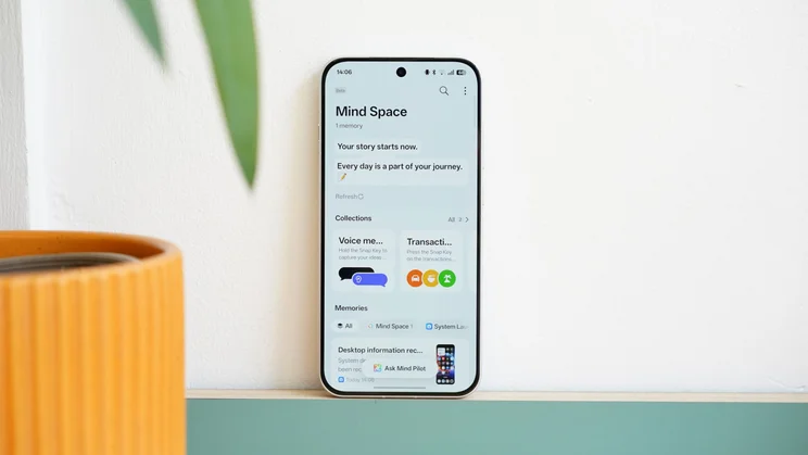 Oppo Reno 16 Pro against a wall, display on
