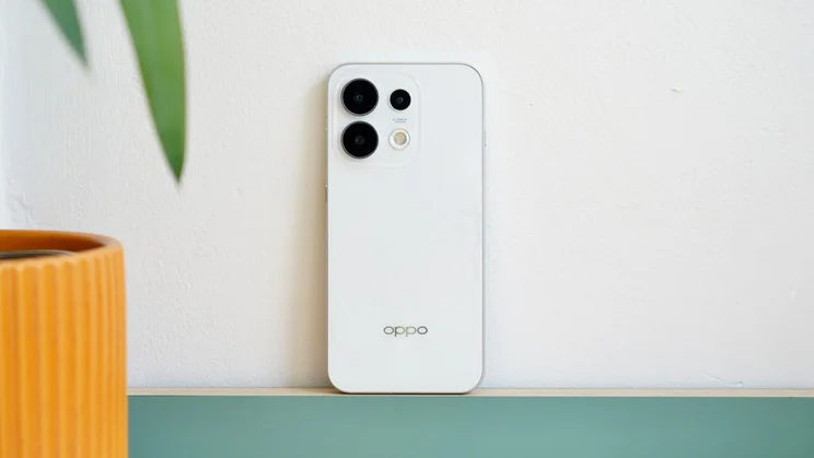 Oppo Reno 16 Pro against a wall, rear view