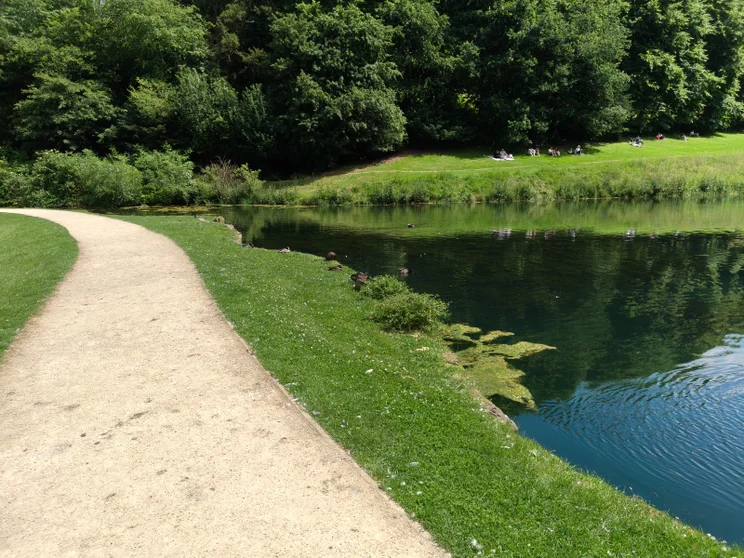 A path leading alongside a river