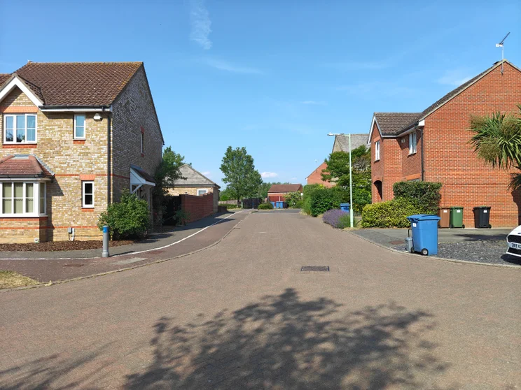 A quiet street with houses on both sides
