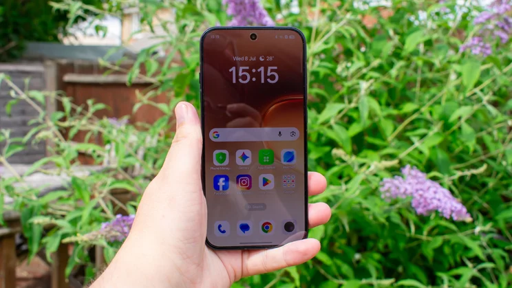 Oppo Reno 16 in hand, front view