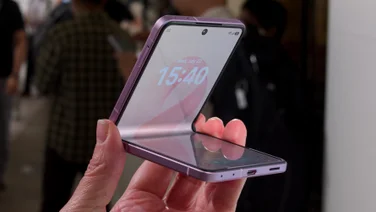 Samsung Galaxy Z Flip 8 in hand, partially unfolded
