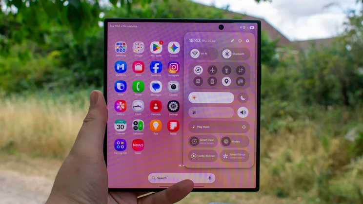 Samsung Galaxy Z Fold 8 Ultra unfolded in hand, homescreen on the display