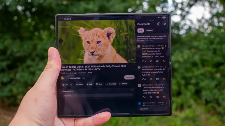 Samsung Galaxy Z Fold 8 Ultra unfolded in hand, displaying YouTube with comments open