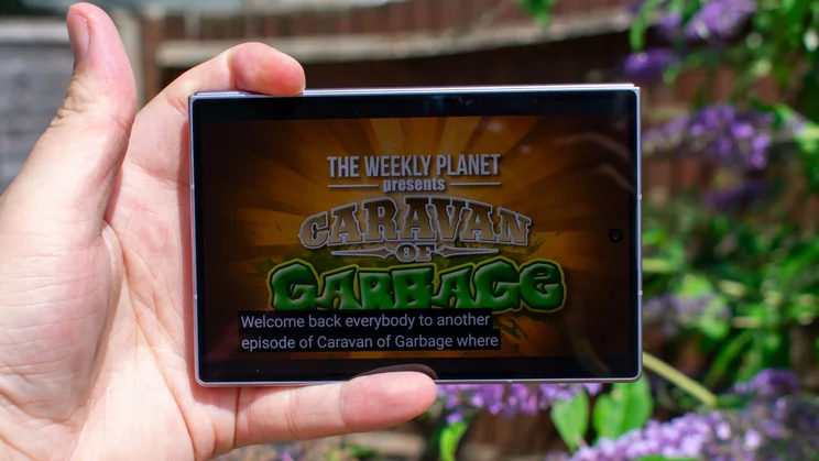 Samsung Galaxy Z Fold 8 in hand, displaying a YouTube video