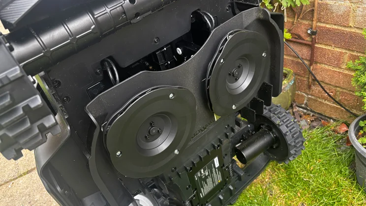 A closeup of the blades on the underside of the Segway Navimow X430 robot lawnmower