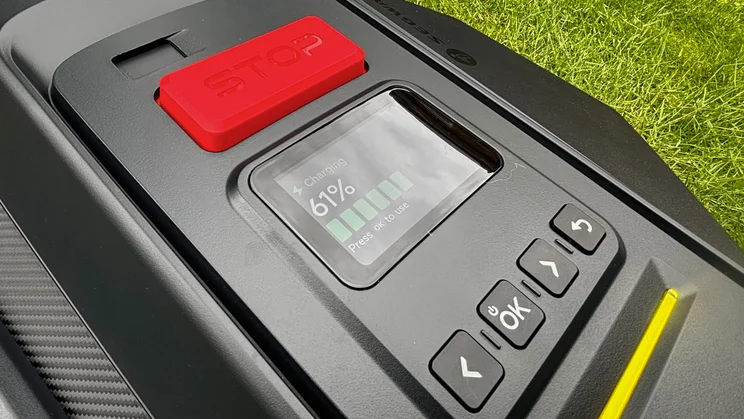 A closeup of the Segway Navimow X430 robot lawnmower's charging screen