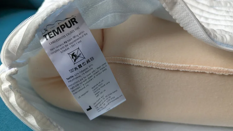 A closeup of the Tempur Cloud SmartCool pillow's care label, on the inside of the pillow's cover