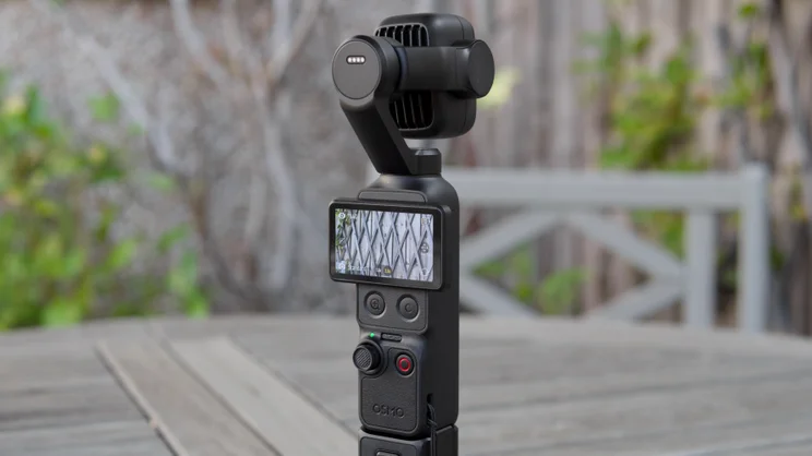 The DJI OSMO Pocket 4P pictured from the rear with the screen in landscape mode