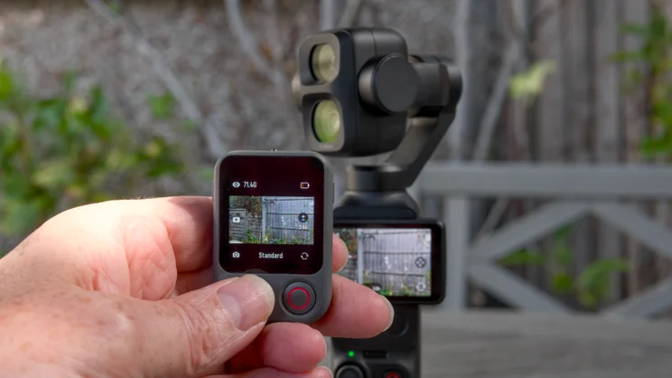The DJI OSMO Pocket 4P pictured with the DJI FrameTap remote control